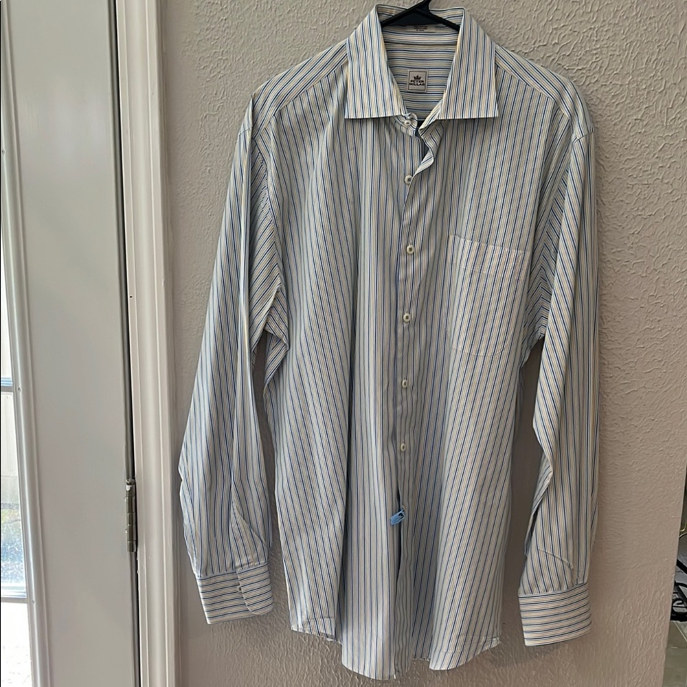 Peter Millar 100% cotton size large dress shirt.  Has been dry cleaned.